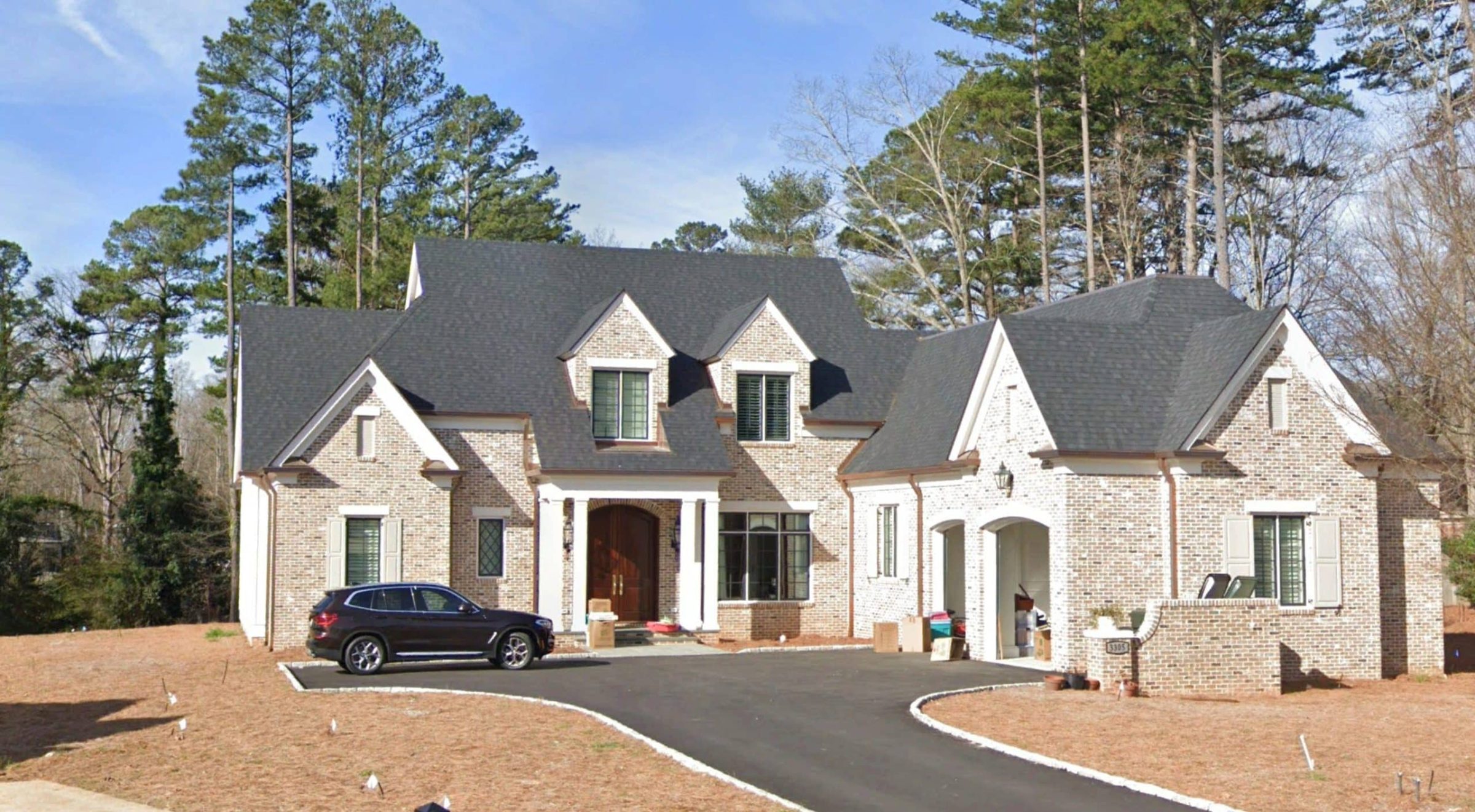 Elegant 2-Story House Plan with Brick Architecture & Vaulted Ceilings
