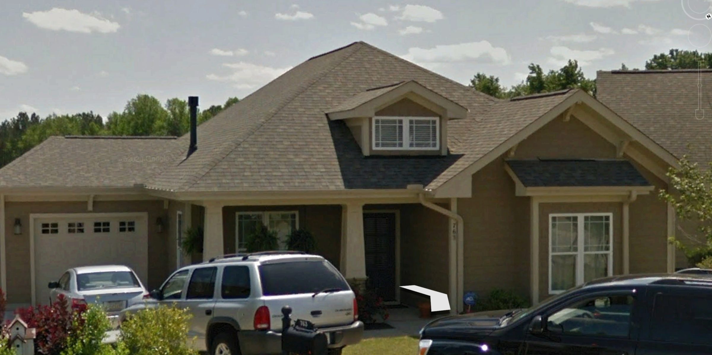 Compact 1-Story Home Plan with Garage and Open Floor Design