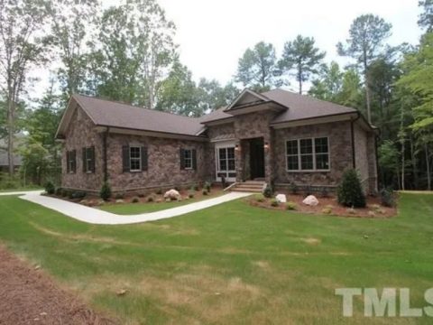 Traditional Craftsman house Plan with 4 Bedrooms and 3-Car Garage