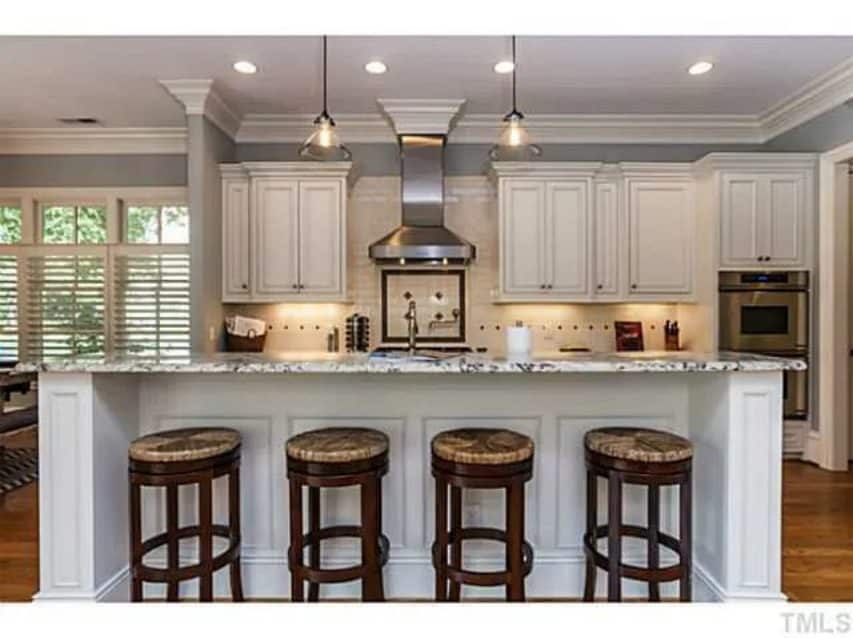 Traditional Craftsman house Plan with 4 Beds,3 Garage Bays,and Vaulted Ceilings