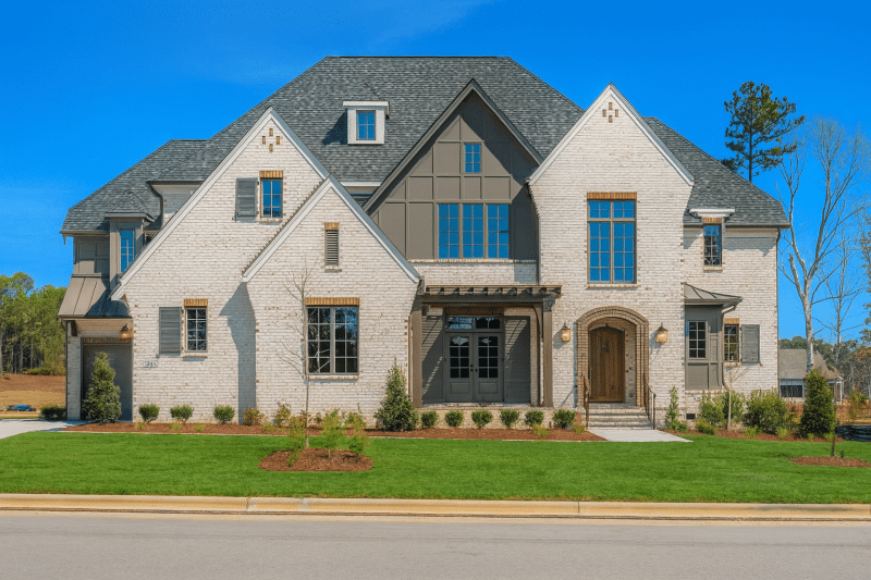 Elegant Tudor-Style House Plan with Luxurious Layout